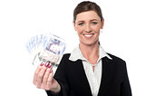 Corprorate woman holding currency notes