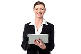 Cheerful business manager holding touch pad