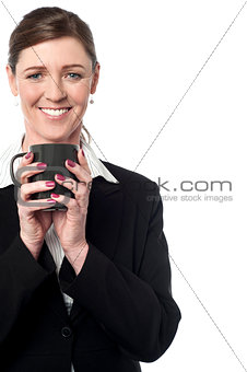 Pretty female manager enjoying her coffee