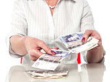 Woman counting currency notes