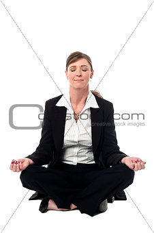 Middle aged doing meditation, lotus pose