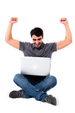 Excited young guy with laptop