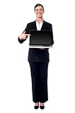 Businesswoman presenting new laptop