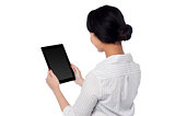 Business woman operating touch pad device