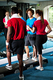 Fit people working out in fitness centre