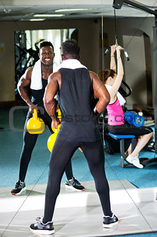 Fitness people working out with equipments