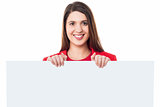 Pretty young girl standing behind banner ad