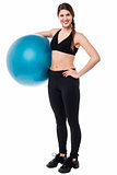 Fitness woman with big blue exercise ball