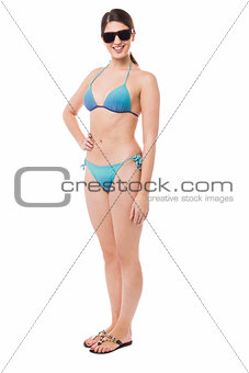 Sexy bikini model, full length studio shot