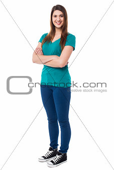 Confident pretty girl posing with arms folded
