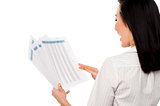 Cheerful female manager holding business reports