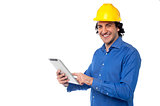Construction worker operating tablet pc