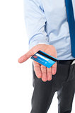 Businessman displaying his cash card