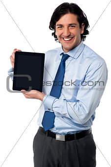 Sales manager displaying newly launched tablet pc