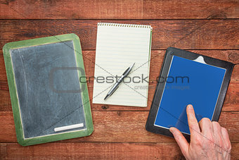 blackboard, notepad and digital tablet