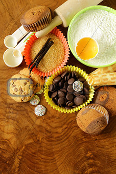 ingredients for baking and desserts cookies, muffins, waffles on a wooden table