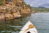 canoe and sandstone cliff