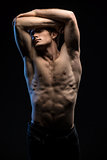 Portrait of handsome red-haired athlete topless at the studio