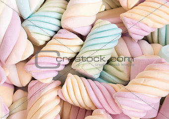 A delicious multicolored marshmallows background. Shallow depth