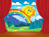 Stage with rainbow and sun