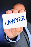 man showing a signboard with the word lawyer