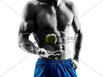 man exercising fitness exercises eating apple  silhouette