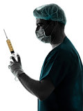 doctor surgeon Anesthetist man holding surgery needle silhouette