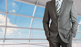 Businessman body with arms in pockets