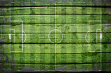 Football stadium with gates painted on wood plank