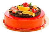 Cake with strawberries and orange slices.