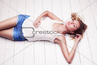 sexy blonde with wet hair woman posing in studio