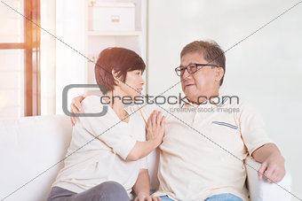 Asian senior couple at home