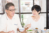Senior couple having meal 
