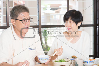 Senior couple having meal 