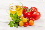 Fresh colorful tomatoes, basil and olive oil