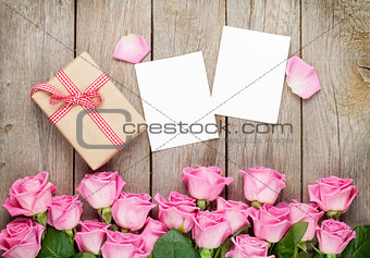 Photo frames, gift box and pink roses