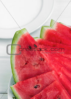 closeup of some pieces of refreshing watermelon on a white background