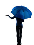 woman rear view holding umbrella palm gesture silhouette