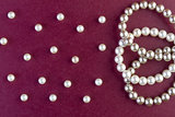 Silver and White pearls necklace on dark red  