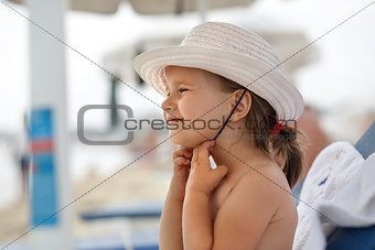 Child in a white hat