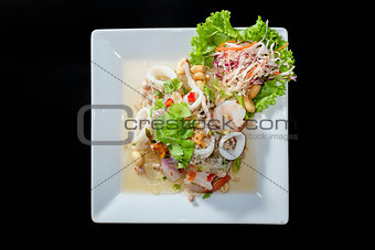 Yum Woon Sen, spicy vermicelli salad in black background