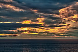 sunset on an overcast sea 