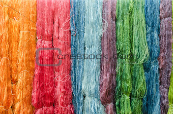colorful silk yarns being dried