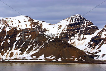 The end of a glacier where it falls into the Arctic Ocean in Spitsbergen, Svalbard, Norway.