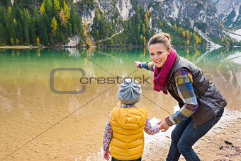 Mother and daughter playing on the shore of Lake Bries