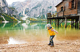Young girl on Lake Bries  in the autumn skipping stones