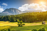 Colorful Alpine scenery with sun setting down