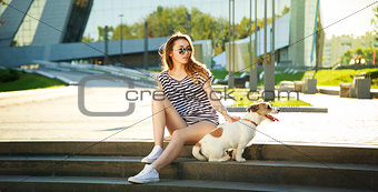 Hipster Fashion Girl with her Dog in the City
