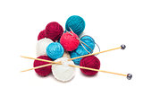 colorful balls of wool with needles