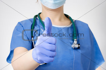 Doctor with thumbs up gesture